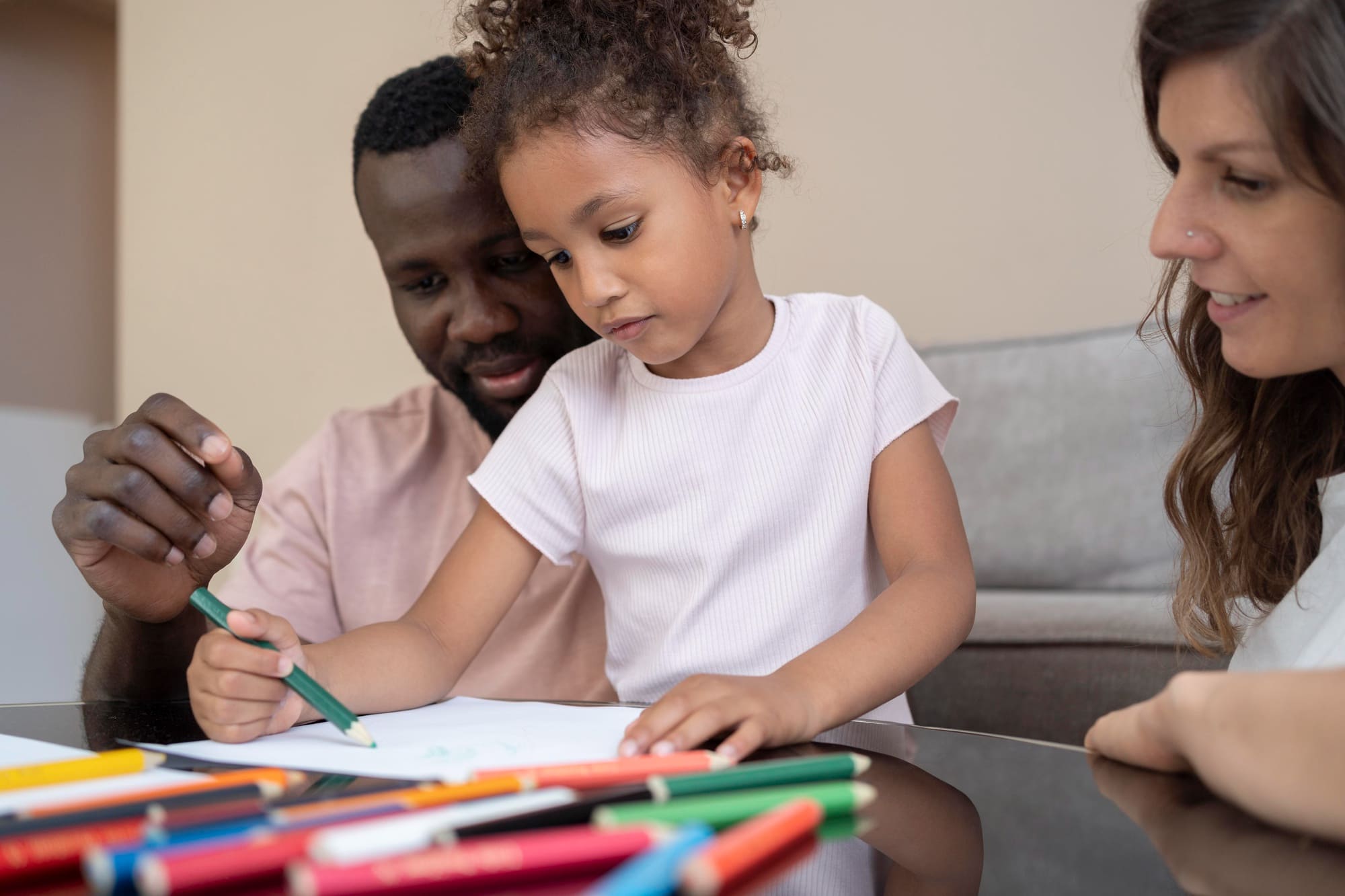 Parent reviewing child progress report with specialist